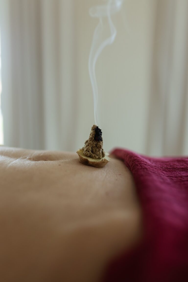 Moxibustion and rebozo wrap used in womb hara massage session Soul of Medicine